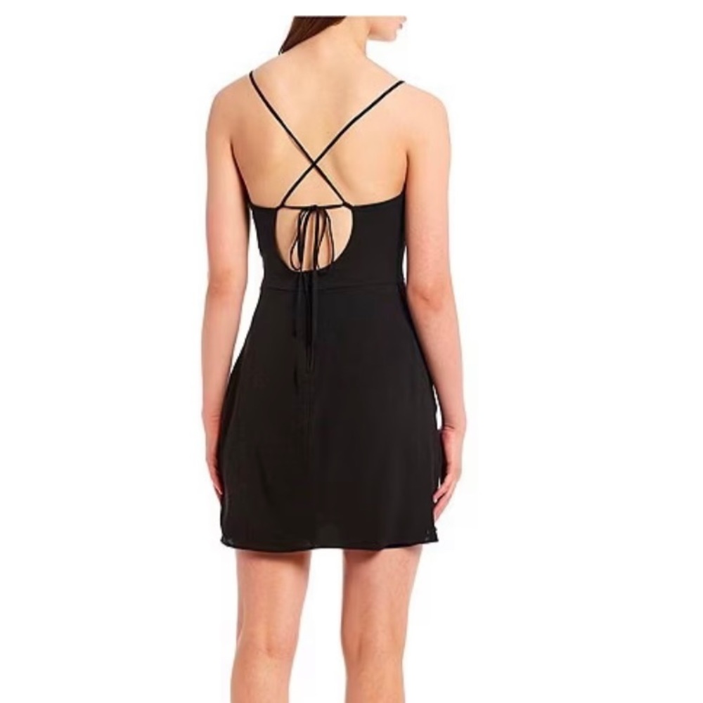 Black. Size 5. Spaghetti strap lace up back tulip hem dress